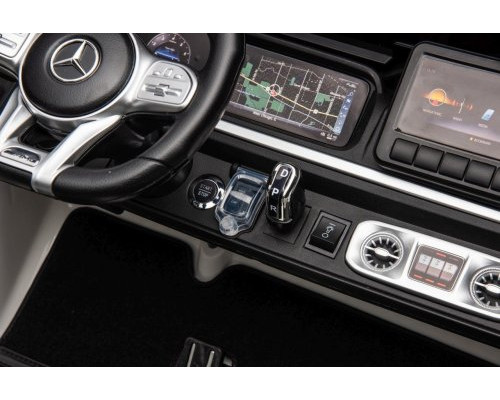 Дитяча акумуляторна машинка Mercedes Benz G63 AMG XXL Біла Дитяча акумуляторна машинка Mercedes Benz G63 AMG XXL Біла